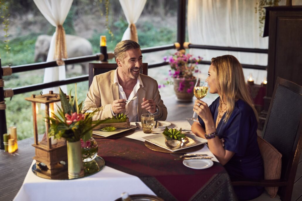 Anantara Golden Triangle Elephant Camp And Resort Property Amenity Restaurant Dining By Design Riverside Couple1 1