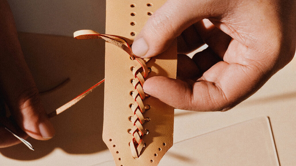 Hand braiding of the natural tanned cowhide handle