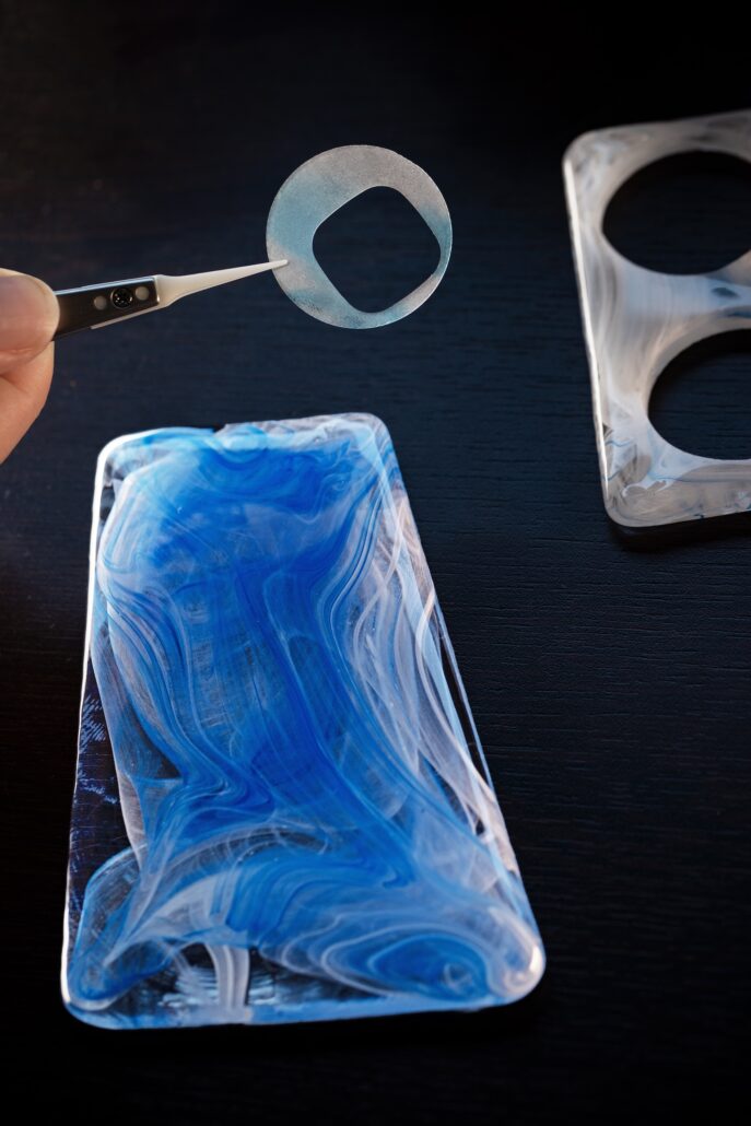 An artisan cuts the dial into a large block of Venini Glass Craft@TiffanyCo